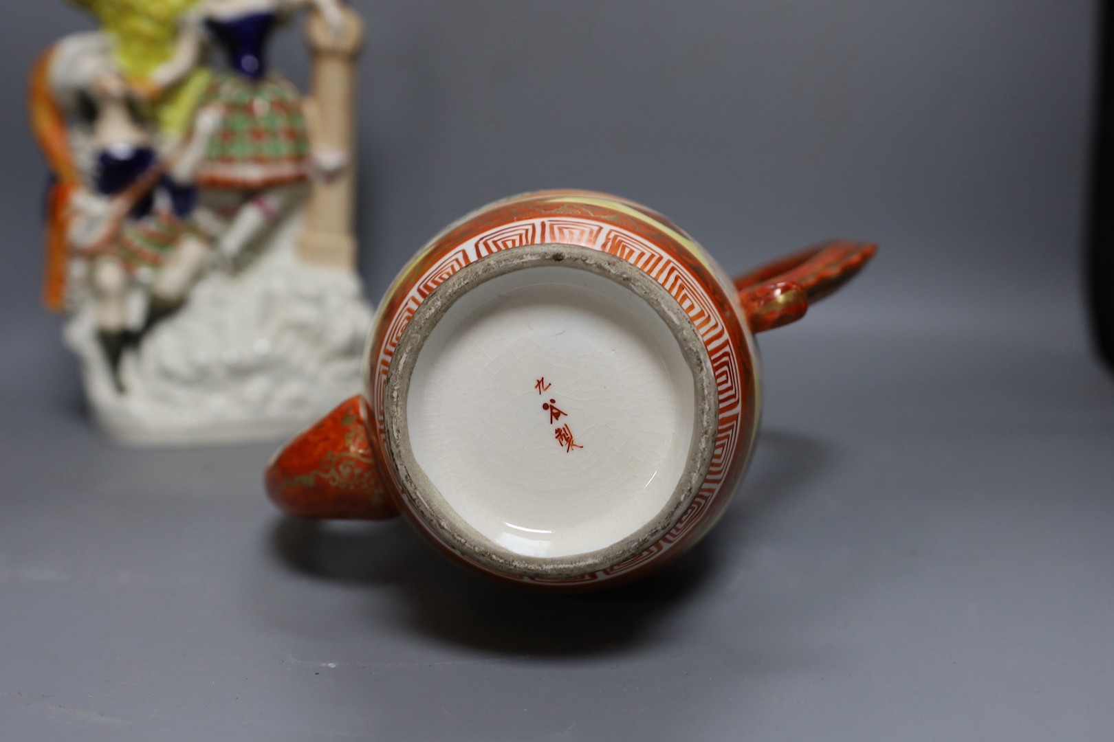 A Victorian Staffordshire flatback group, a pair of Staffordshire figures, an inkwell and a Japanese kutani coffee pot 32cm